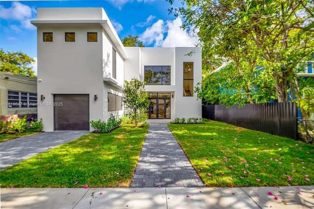 1513 SW 11th Ter, Miami, FL 33135 - contemporary house with stucco siding, an attached garage, and driveway