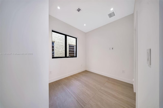1513 SW 11th Ter, Miami, FL 33135 - unfurnished room with baseboards, light wood-style floors, and recessed lighting