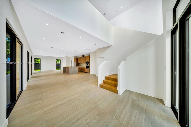 1513 SW 11th Ter, Miami, FL 33135 - unfurnished living room with stairs, recessed lighting, and baseboards