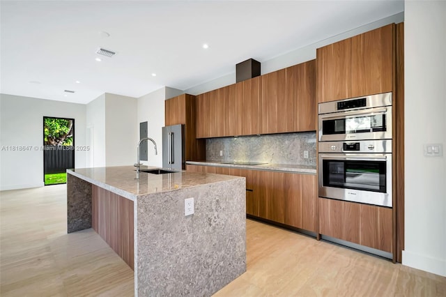1513 SW 11th Ter, Miami, FL 33135 - kitchen featuring stainless steel appliances, brown cabinets, backsplash, modern cabinets, and recessed lighting