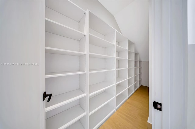 1513 SW 11th Ter, Miami, FL 33135 - walk in closet featuring vaulted ceiling and wood finished floors