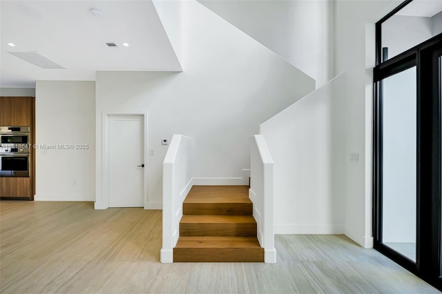 1513 SW 11th Ter, Miami, FL 33135 - stairway featuring wood finished floors, baseboards, and healthy amount of natural light