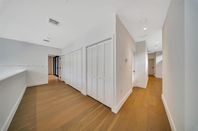 1513 SW 11th Ter, Miami, FL 33135 - hallway with light wood-style flooring and baseboards