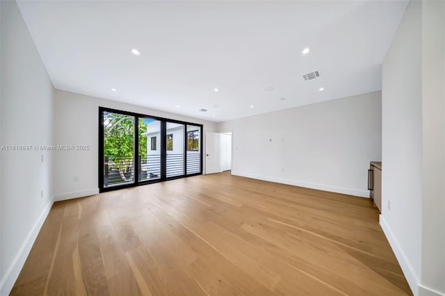 1513 SW 11th Ter, Miami, FL 33135 - empty room featuring light wood-type flooring, baseboards, and recessed lighting