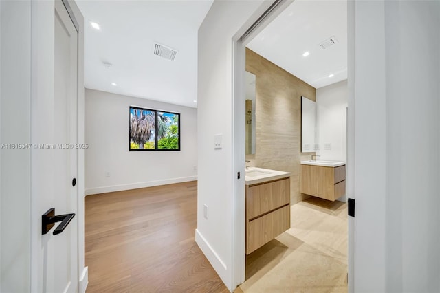 1513 SW 11th Ter, Miami, FL 33135 - corridor with baseboards, a sink, recessed lighting, and light wood-style floors