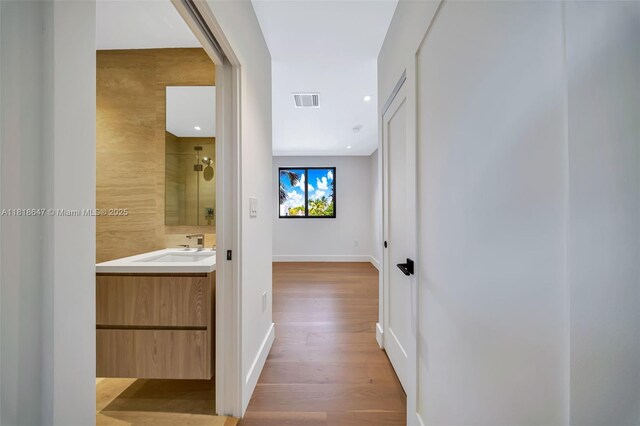 1513 SW 11th Ter, Miami, FL 33135 - hall featuring wood finished floors, a sink, baseboards, and recessed lighting