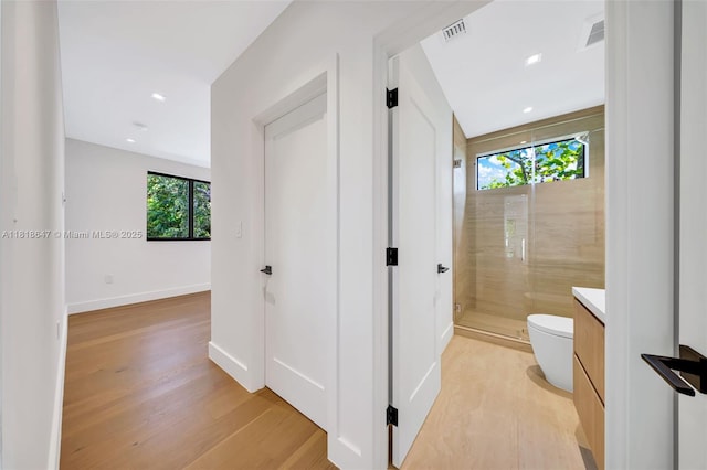 1513 SW 11th Ter, Miami, FL 33135 - bathroom with toilet, a shower stall, vanity, wood finished floors, and baseboards