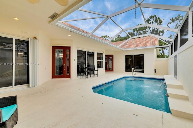 769 SW Munjack Cir, Port St Lucie, FL 34986 - swimming pool featuring a patio and glass enclosure