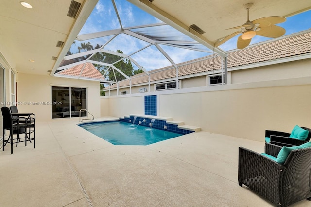 769 SW Munjack Cir, Port St Lucie, FL 34986 - view of swimming pool featuring a patio, ceiling fan, and glass enclosure