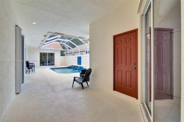 769 SW Munjack Cir, Port St Lucie, FL 34986 - view of swimming pool featuring a patio and glass enclosure