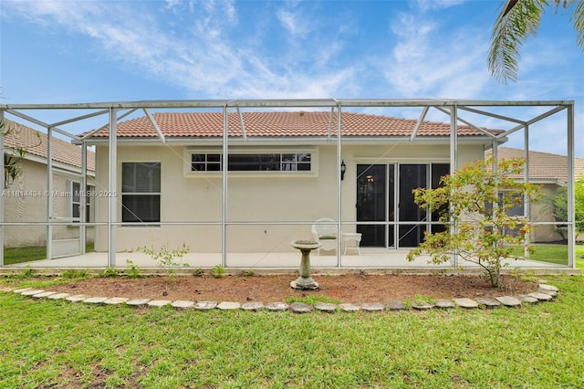 769 SW Munjack Cir, Port St Lucie, FL 34986 - back of house with a tiled roof, a lanai, and a yard