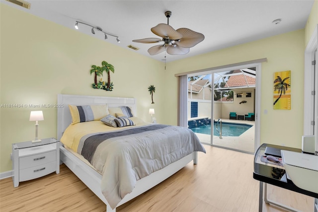 769 SW Munjack Cir, Port St Lucie, FL 34986 - bedroom with access to exterior, light wood-style floors, track lighting, and a ceiling fan