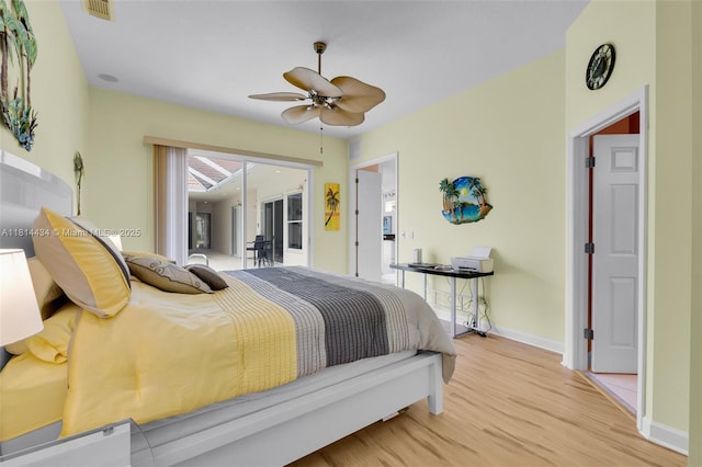 769 SW Munjack Cir, Port St Lucie, FL 34986 - bedroom with wood finished floors, baseboards, access to outside, and ceiling fan