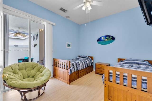 769 SW Munjack Cir, Port St Lucie, FL 34986 - bedroom featuring light wood finished floors, access to exterior, and ceiling fan
