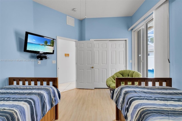 769 SW Munjack Cir, Port St Lucie, FL 34986 - bedroom with light wood-type flooring and a closet