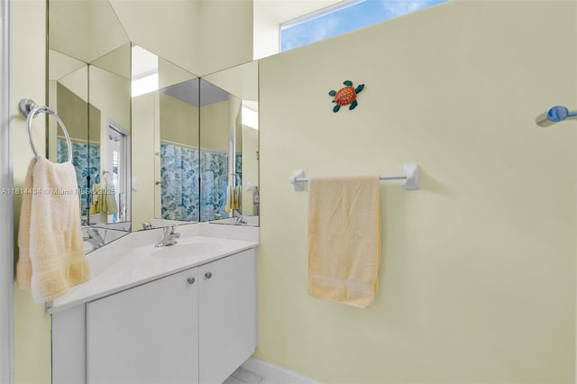 769 SW Munjack Cir, Port St Lucie, FL 34986 - full bath with vanity, a shower with curtain, and baseboards