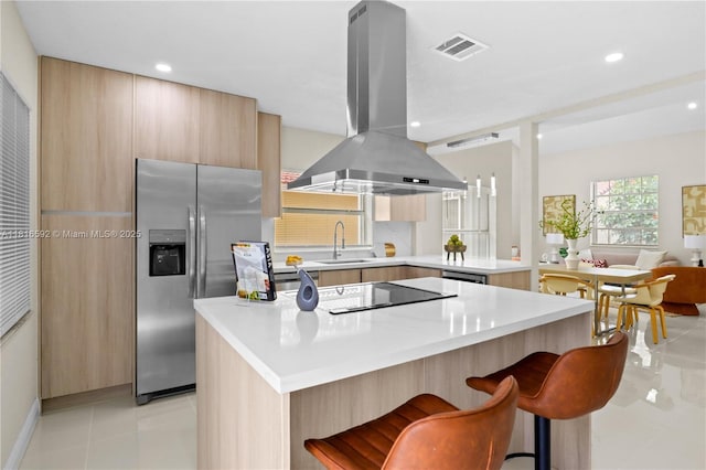 12633 NW 12th Ct, Sunrise, FL 33323 - kitchen featuring island exhaust hood, stainless steel refrigerator with ice dispenser, a sink, modern cabinets, and light tile patterned floors
