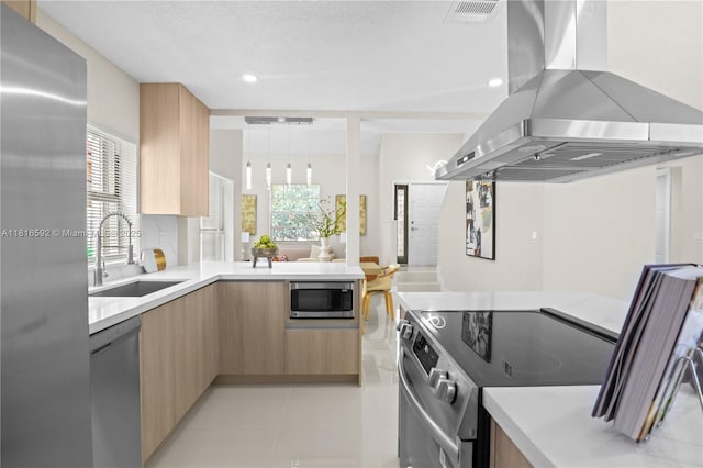 12633 NW 12th Ct, Sunrise, FL 33323 - kitchen with wall chimney range hood, stainless steel appliances, a sink, modern cabinets, and light brown cabinetry