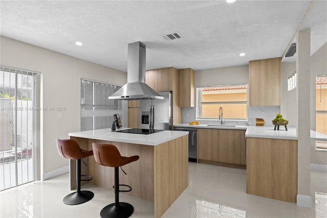 12633 NW 12th Ct, Sunrise, FL 33323 - kitchen featuring island range hood, stainless steel appliances, modern cabinets, a sink, and recessed lighting