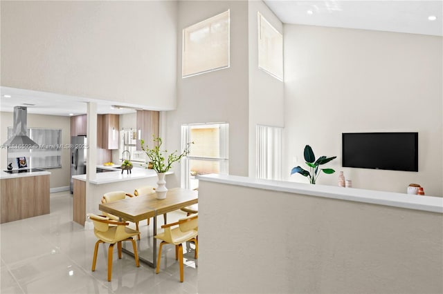 12633 NW 12th Ct, Sunrise, FL 33323 - dining room with a towering ceiling, light tile patterned floors, and recessed lighting