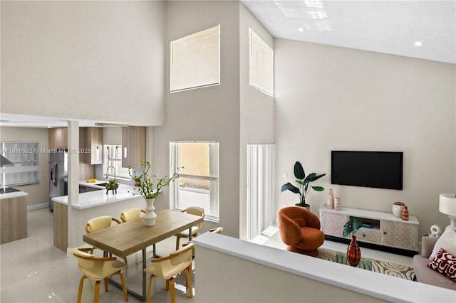 12633 NW 12th Ct, Sunrise, FL 33323 - dining space with a high ceiling, light tile patterned flooring, and recessed lighting