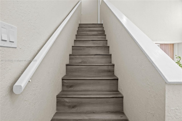 12633 NW 12th Ct, Sunrise, FL 33323 - stairs with a textured wall