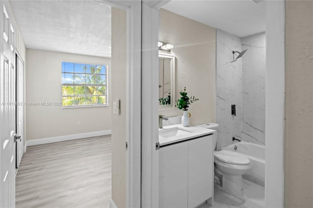 12633 NW 12th Ct, Sunrise, FL 33323 - bathroom featuring vanity, toilet, shower / bath combination, baseboards, and a textured ceiling