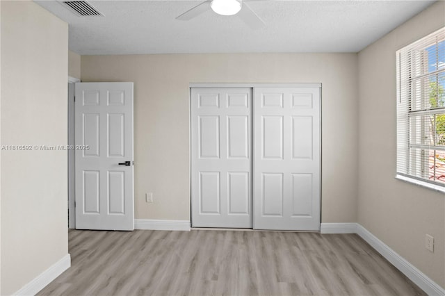 12633 NW 12th Ct, Sunrise, FL 33323 - unfurnished bedroom with light wood finished floors, baseboards, a closet, and ceiling fan