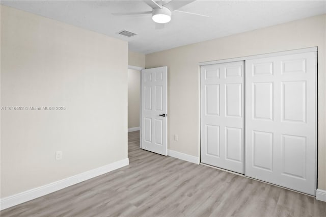 12633 NW 12th Ct, Sunrise, FL 33323 - unfurnished bedroom with wood finished floors, baseboards, a closet, and ceiling fan