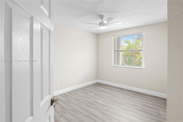 12633 NW 12th Ct, Sunrise, FL 33323 - unfurnished bedroom with wood finished floors, baseboards, a textured ceiling, and ceiling fan