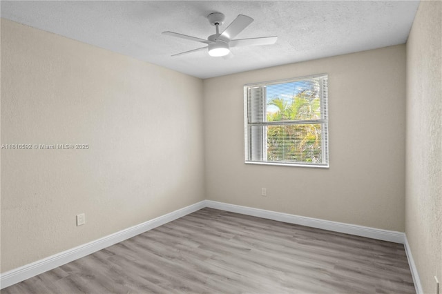 12633 NW 12th Ct, Sunrise, FL 33323 - empty room featuring wood finished floors, a textured ceiling, ceiling fan, and baseboards