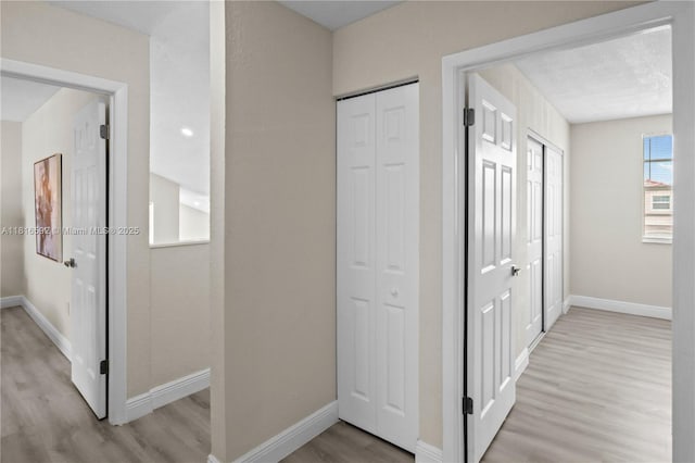 12633 NW 12th Ct, Sunrise, FL 33323 - hall featuring light wood-style flooring and baseboards