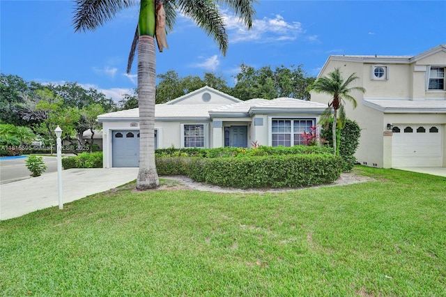 9601 NW 8th Cir, Plantation, FL 33324 - view of front of house featuring concrete driveway, stucco siding, a front lawn, and a garage