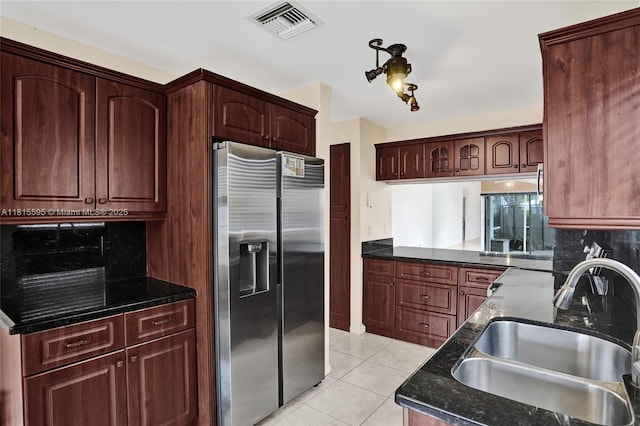 9601 NW 8th Cir, Plantation, FL 33324 - kitchen with stainless steel fridge, a sink, tasteful backsplash, and light tile patterned floors