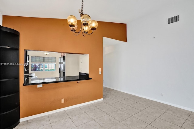 9601 NW 8th Cir, Plantation, FL 33324 - kitchen with a chandelier, stainless steel refrigerator with ice dispenser, baseboards, hanging light fixtures, and a high ceiling