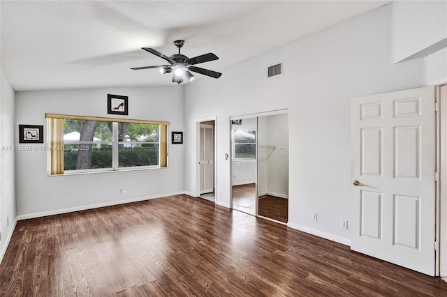 9601 NW 8th Cir, Plantation, FL 33324 - unfurnished bedroom with vaulted ceiling, wood finished floors, multiple closets, baseboards, and a ceiling fan