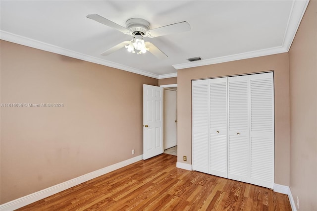 9601 NW 8th Cir, Plantation, FL 33324 - unfurnished bedroom featuring light wood-style floors, baseboards, a closet, ornamental molding, and a ceiling fan