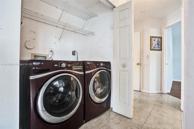 9601 NW 8th Cir, Plantation, FL 33324 - washroom featuring washer and dryer and light tile patterned floors