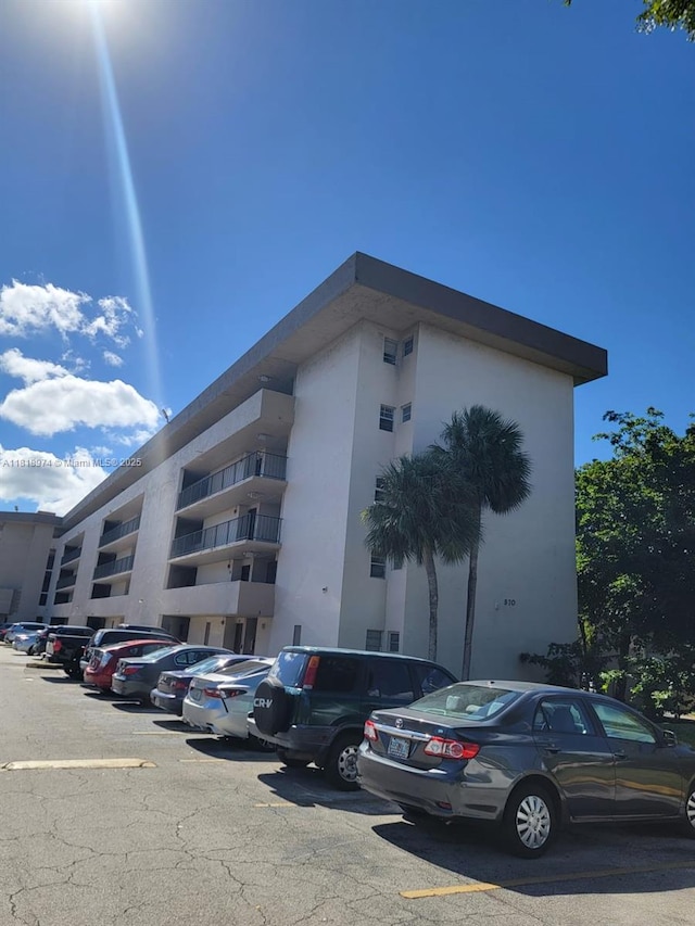 870 NW 87th Ave Unit 310, Miami, FL 33172 - view of apartment building / complex featuring uncovered parking
