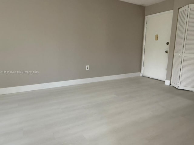 870 NW 87th Ave Unit 310, Miami, FL 33172 - unfurnished room featuring baseboards and wood finished floors