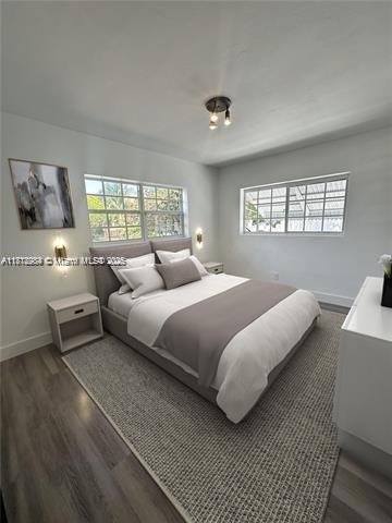 280 NE 169th St, North Miami Beach, FL 33162 - bedroom featuring dark wood finished floors
