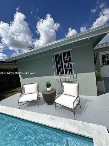 280 NE 169th St, North Miami Beach, FL 33162 - outdoor pool featuring a patio area