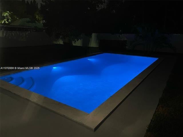 280 NE 169th St, North Miami Beach, FL 33162 - pool at night with an outdoor pool