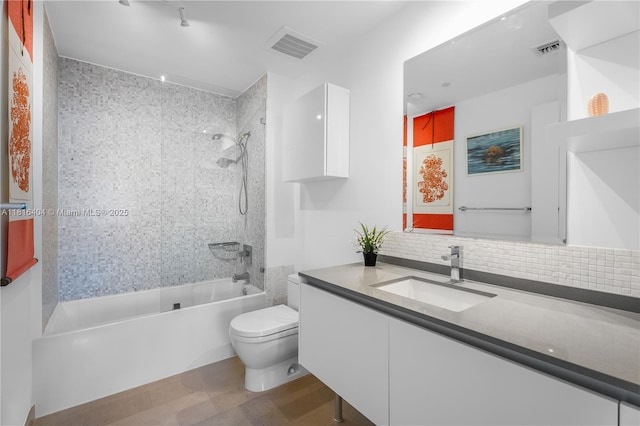 68 SE 6th St Unit 1704, Miami, FL 33131 - bathroom with toilet, vanity, shower / bathtub combination, and tasteful backsplash
