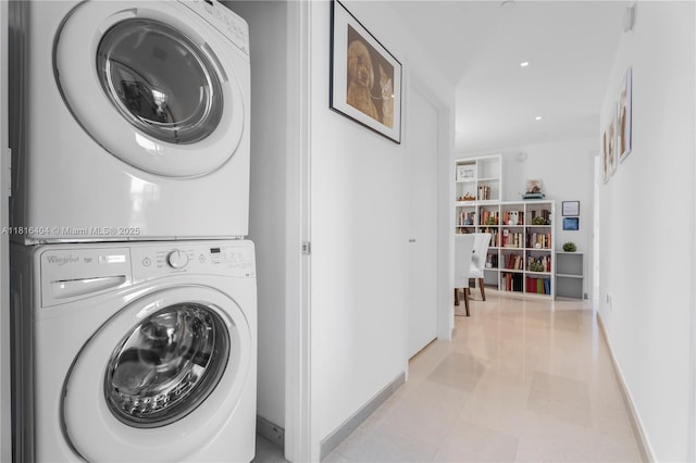 68 SE 6th St Unit 1704, Miami, FL 33131 - laundry room with stacked washer / dryer, baseboards, built in features, and light tile patterned floors