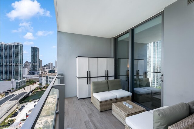 68 SE 6th St Unit 1704, Miami, FL 33131 - balcony with a skyline view and a water view