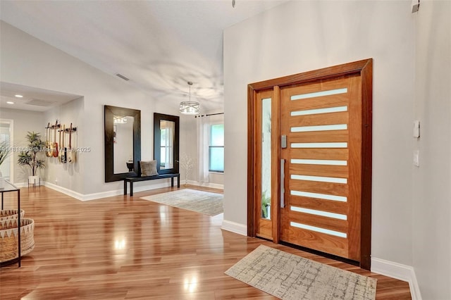 18366 Lake Bend Dr, Jupiter, FL 33458 - entrance foyer featuring wood finished floors and lofted ceiling