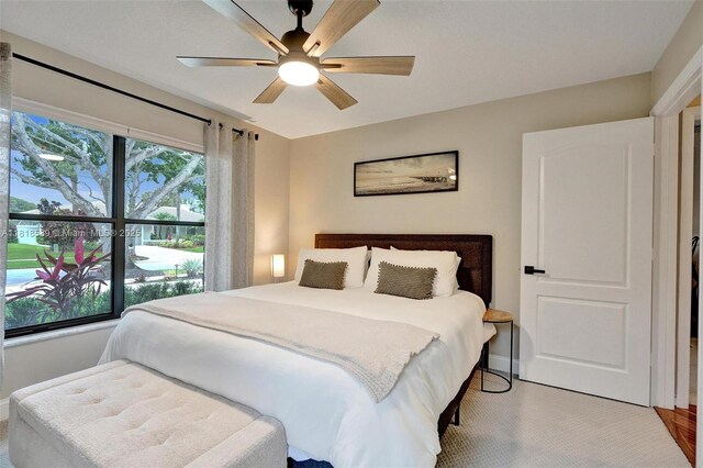 18366 Lake Bend Dr, Jupiter, FL 33458 - bedroom with baseboards and ceiling fan