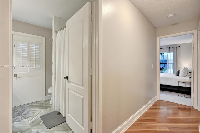 18366 Lake Bend Dr, Jupiter, FL 33458 - hallway featuring baseboards and light wood-style floors