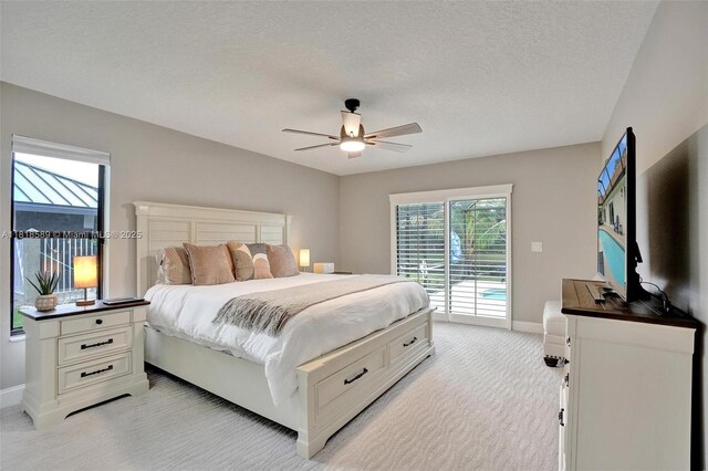 18366 Lake Bend Dr, Jupiter, FL 33458 - bedroom featuring access to outside, light carpet, ceiling fan, and a textured ceiling